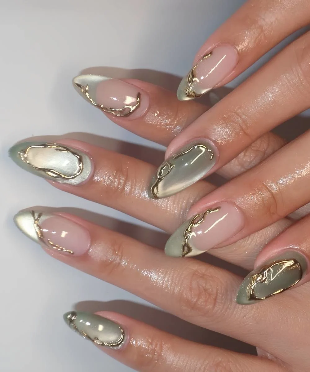 Jade green cat eye nails with gold accents