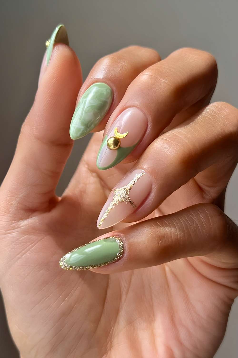 Jade green nails with marble and gold accents