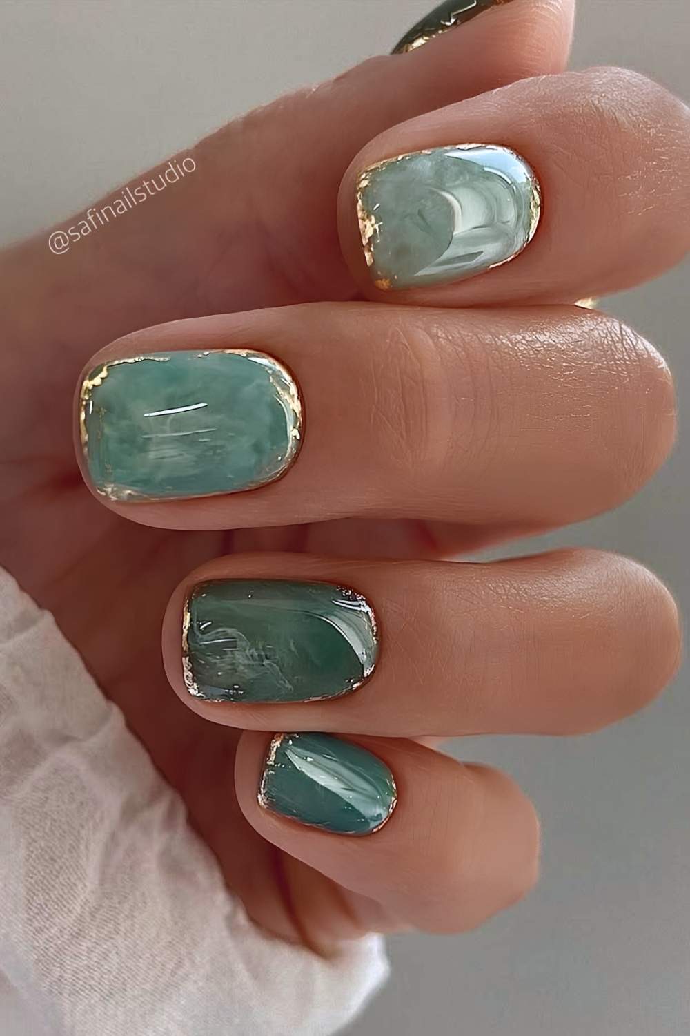Jade marble nails with gold detailing