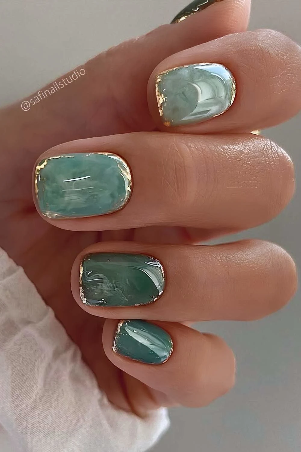 Jade marble nails with gold detailing