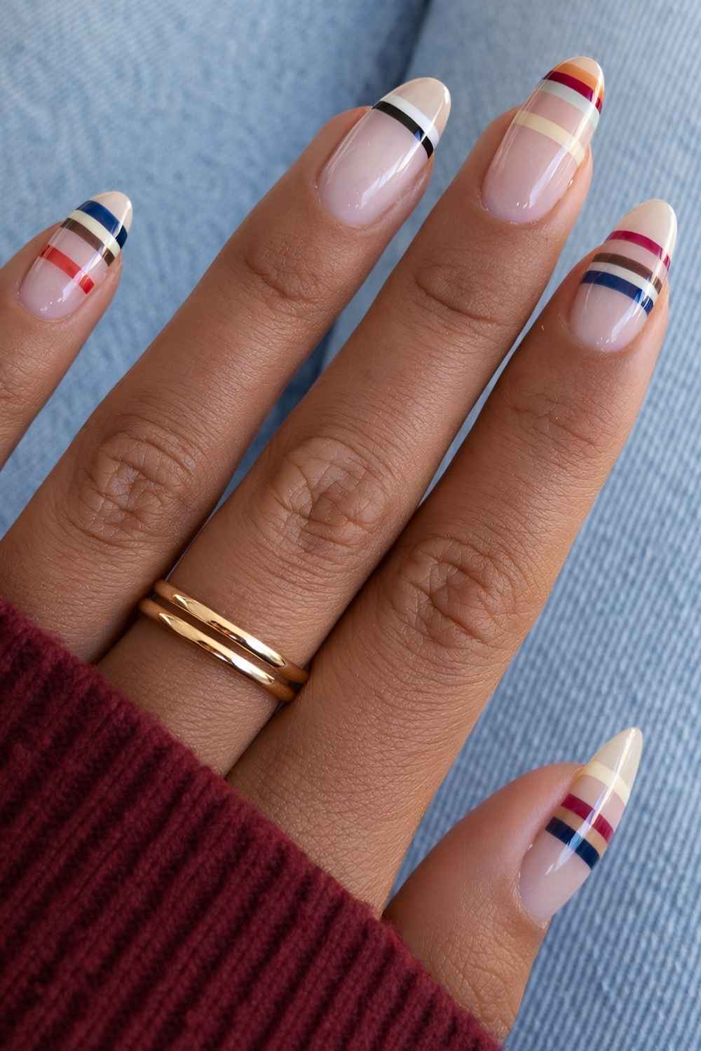 Milky nails with colorful stripes