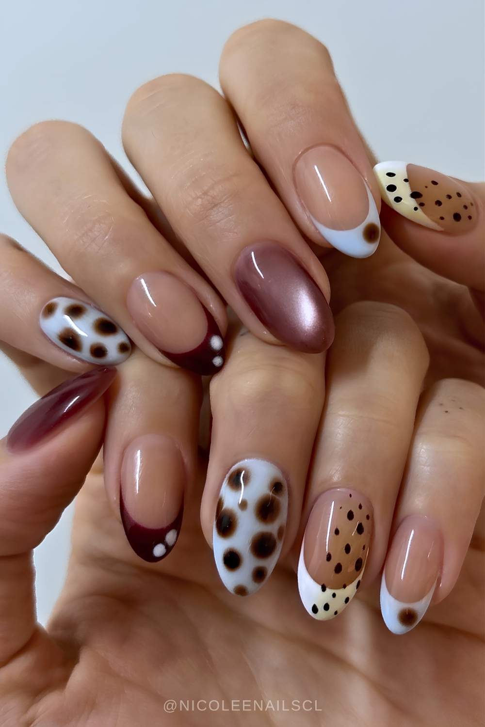Mismatched muted nails with accent cat eye and bambi print