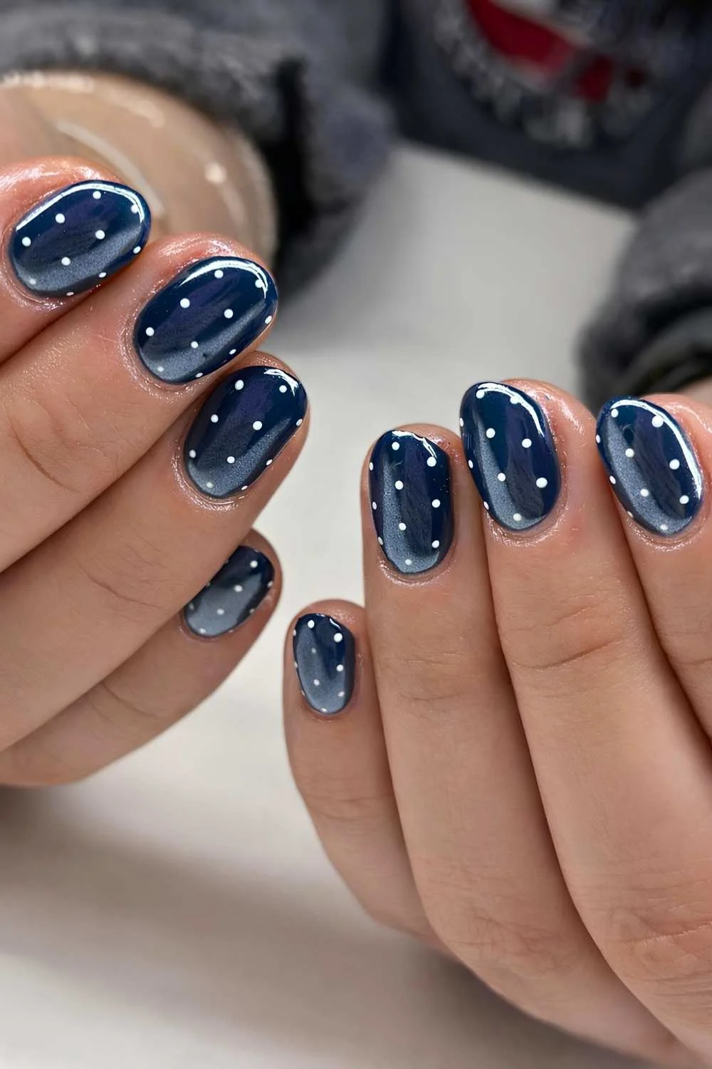 Navy blue chrome mani with polka dots
