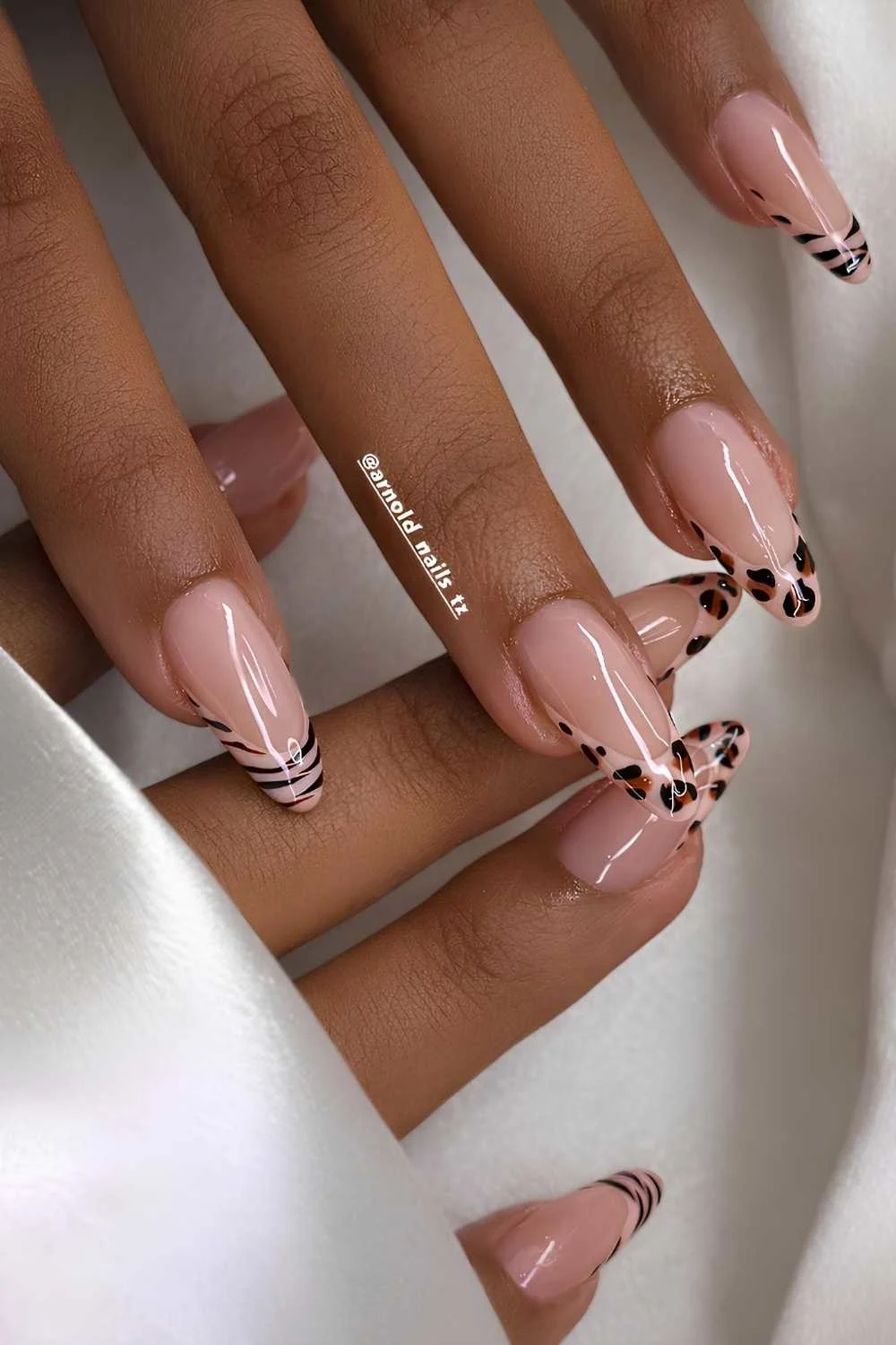 Neutral French manicure with accent animal print