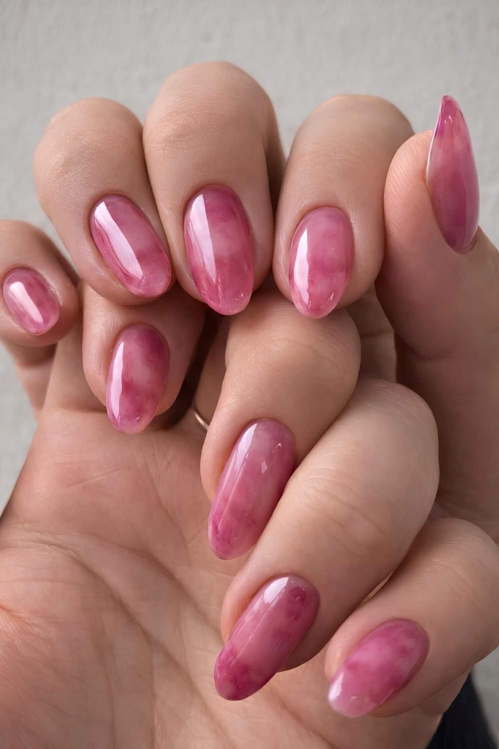 Pink jelly nails with marble patterns