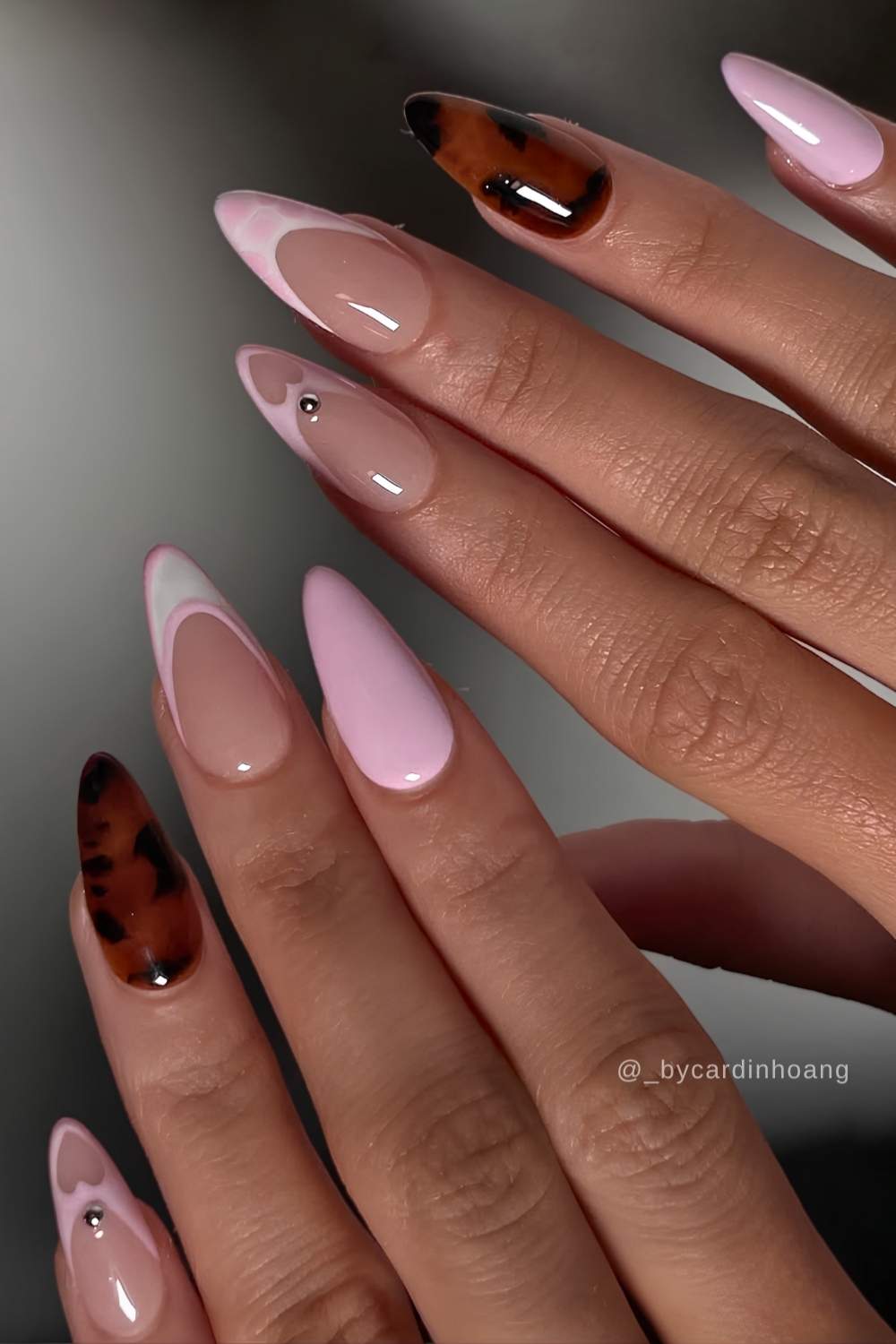 Pink nails with accent hearts and tortie shell