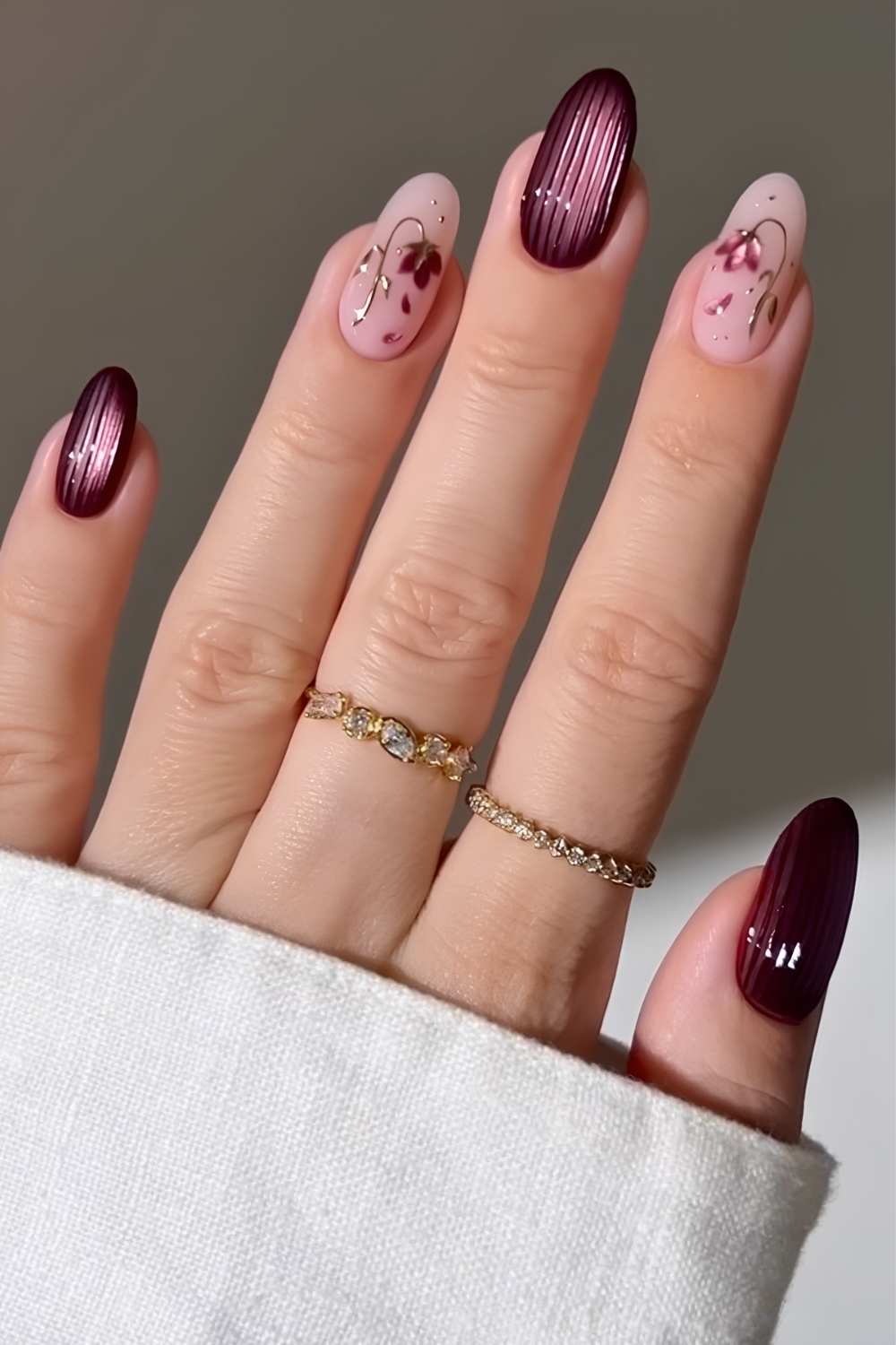Plum ribbed glass mani with accent flowers