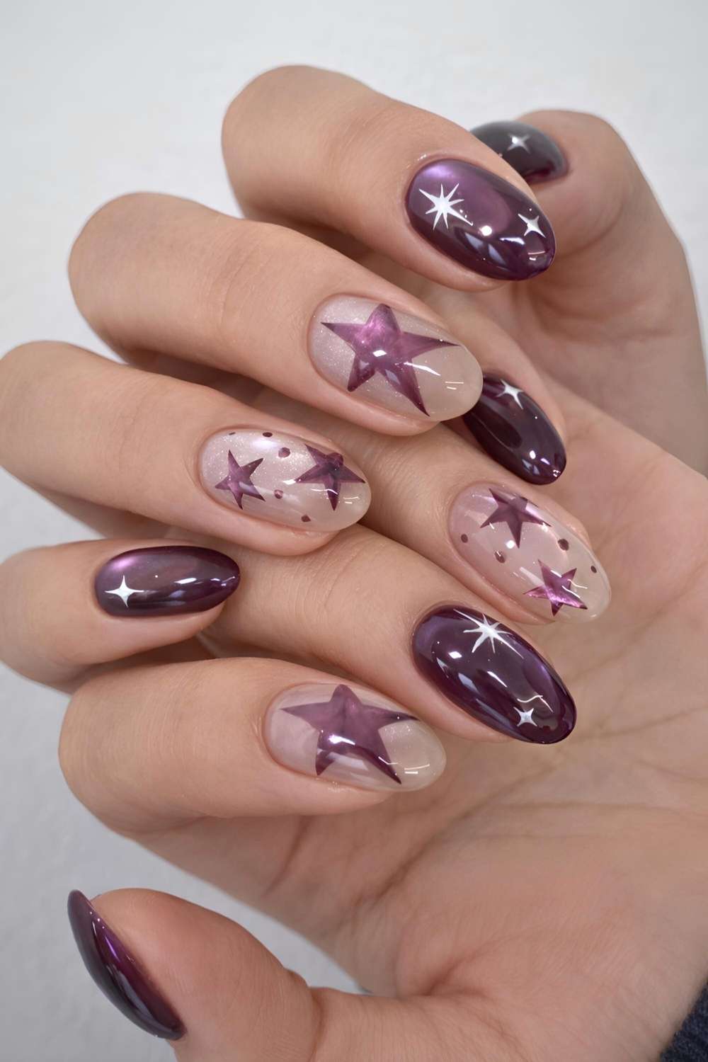 Purple cat eye nails with star art
