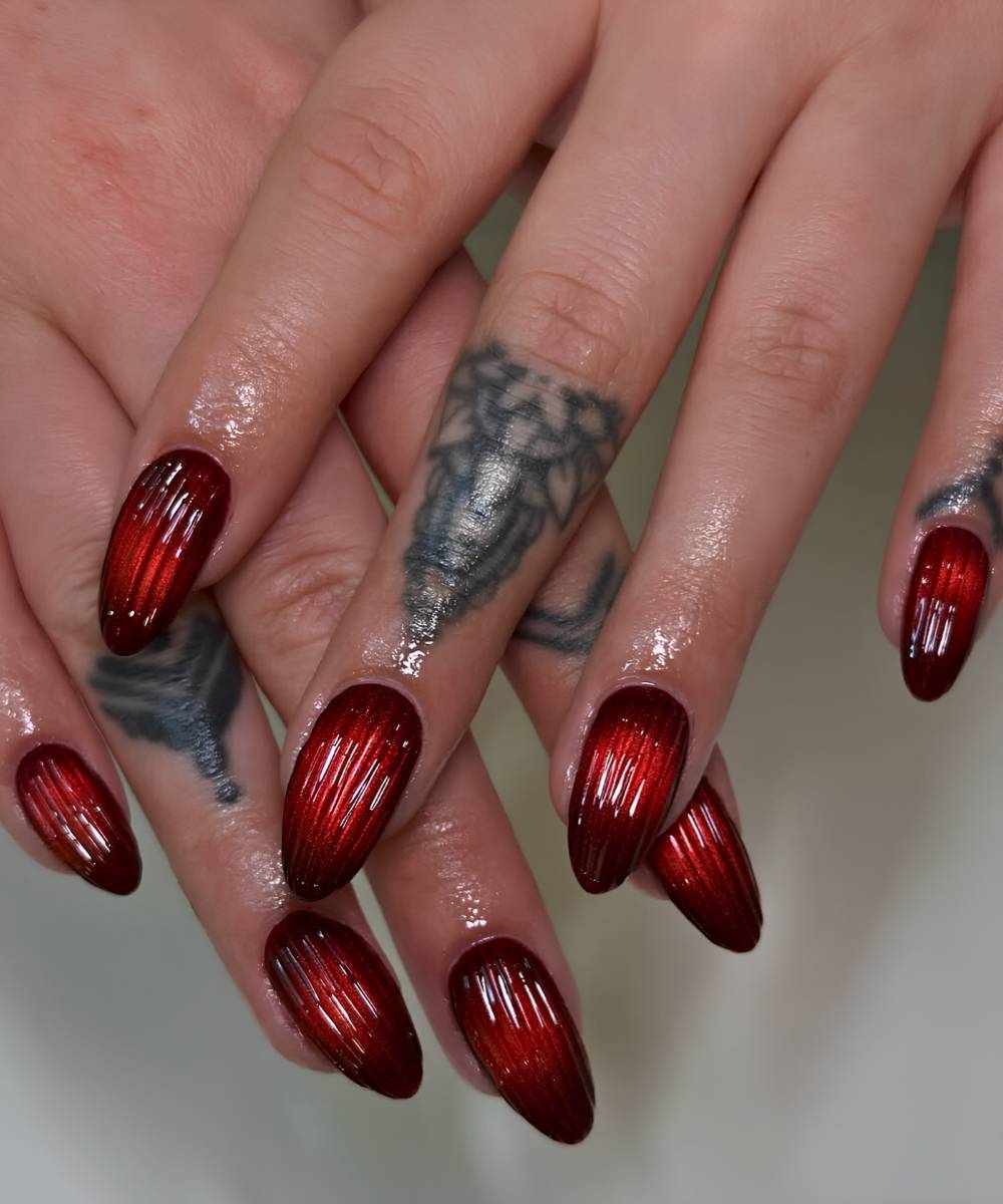 Red matte cat eye nails with 3d stripes