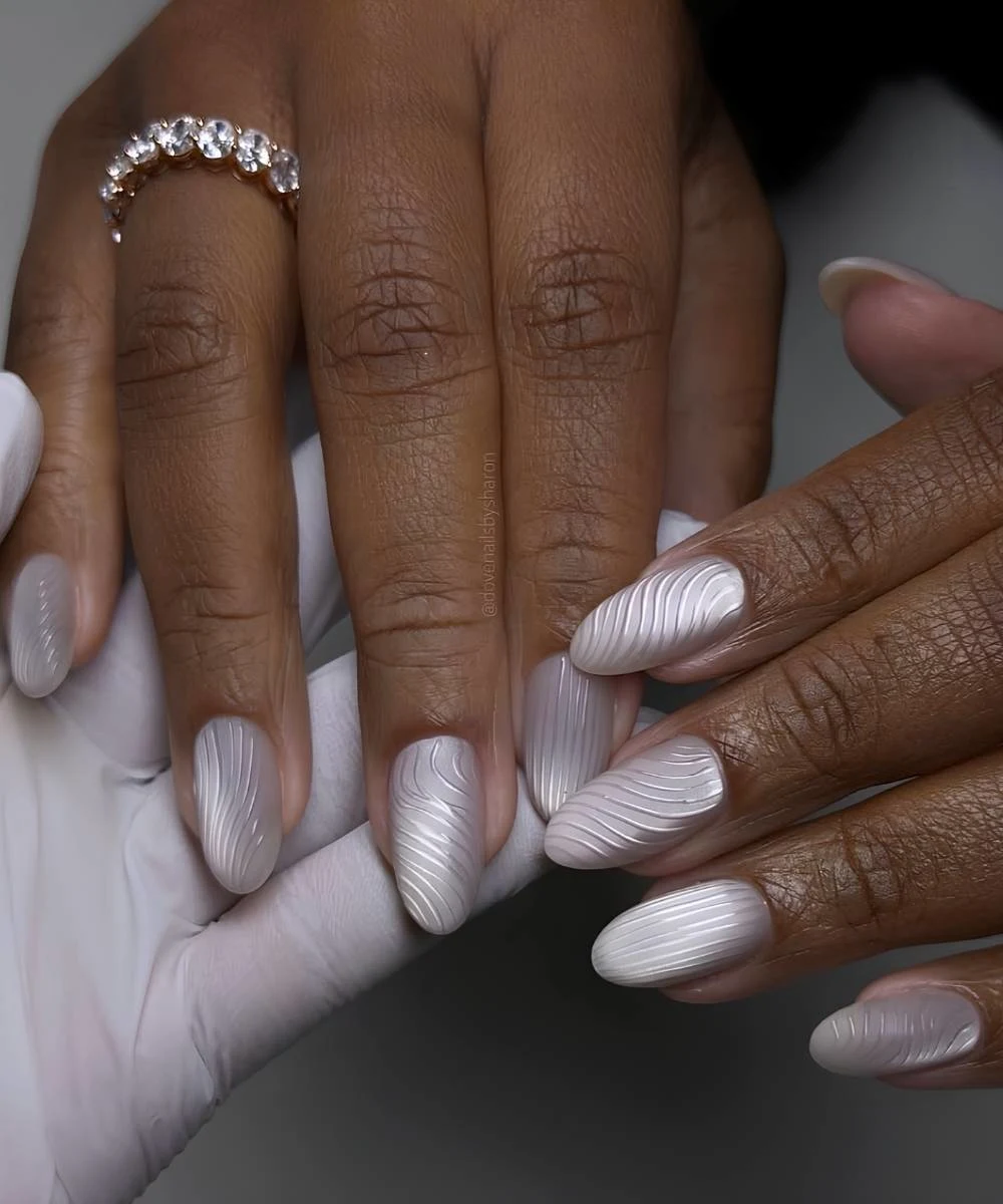 Silver glass nails with textured swirls
