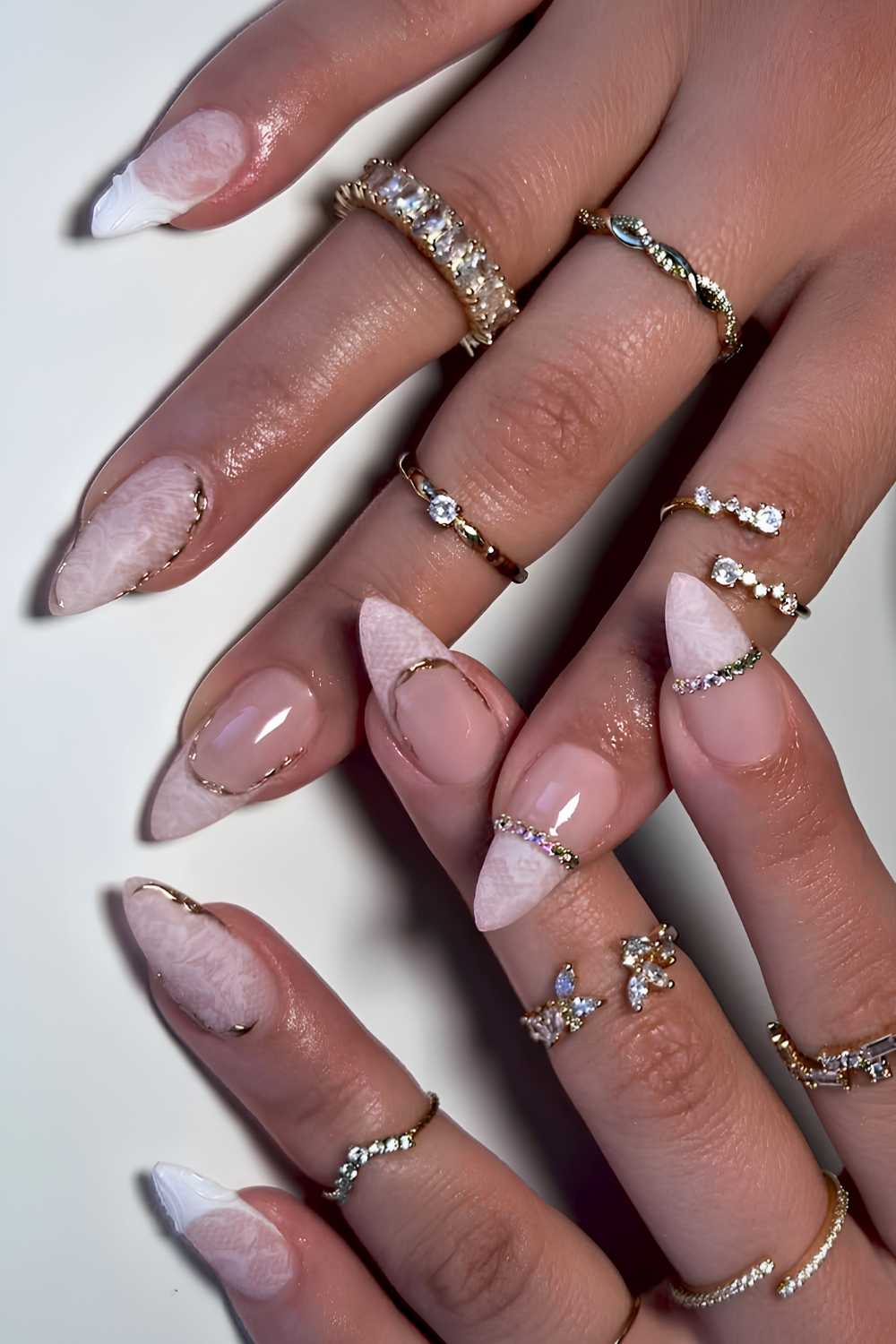 White lace nails with rhinestone details