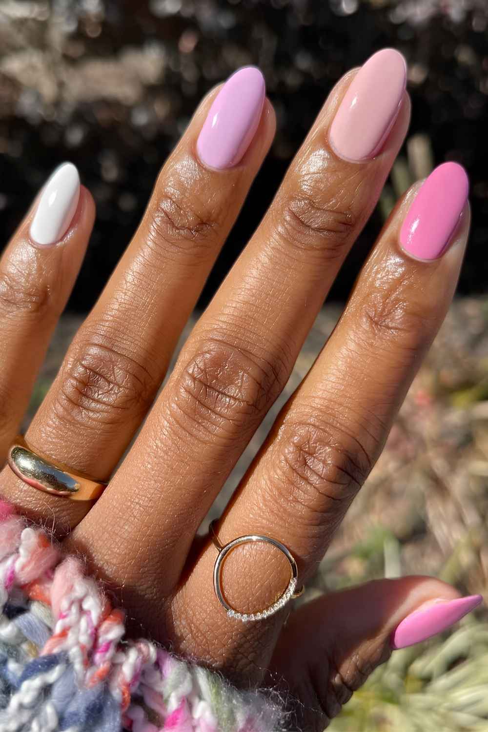 Almond skittle mani in different pink shades
