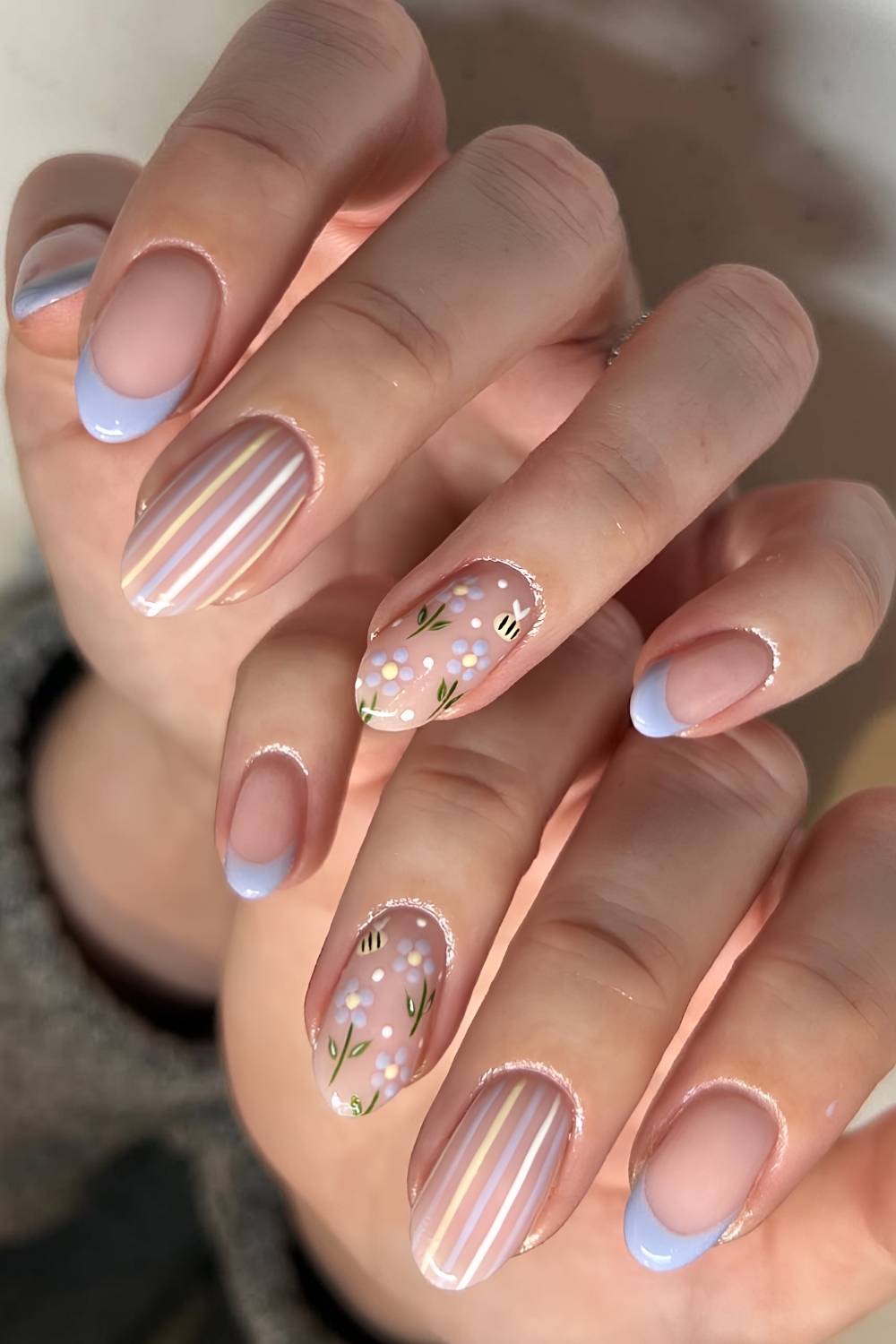 Blue French nails with stripes and bees