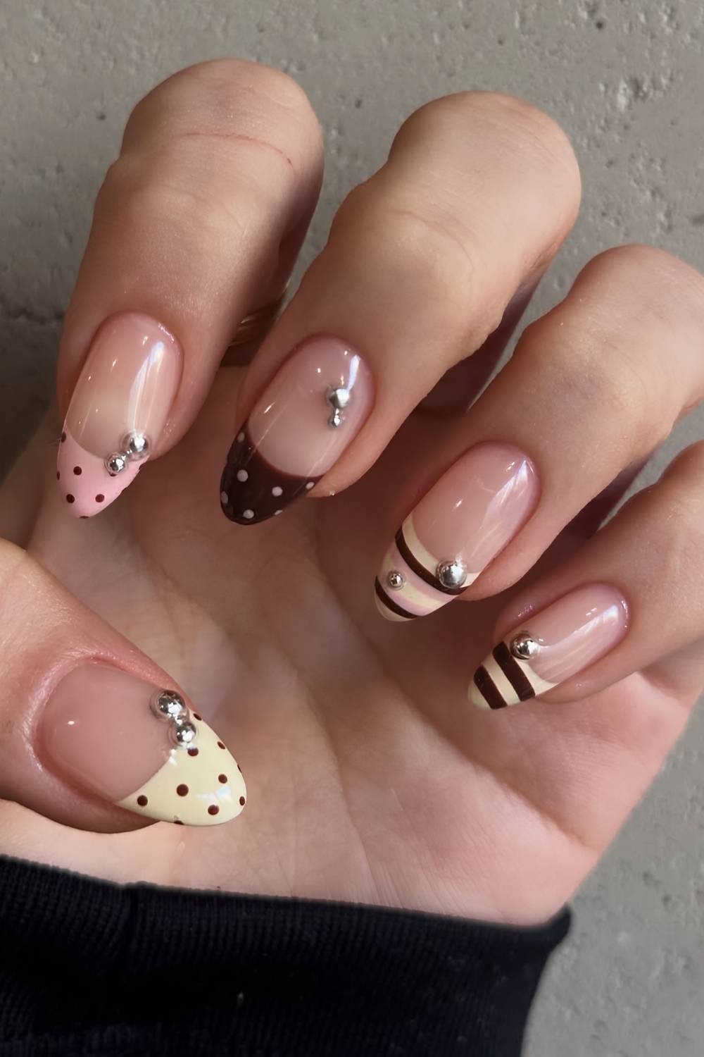 Brown and yellow french nails with stripes and dots