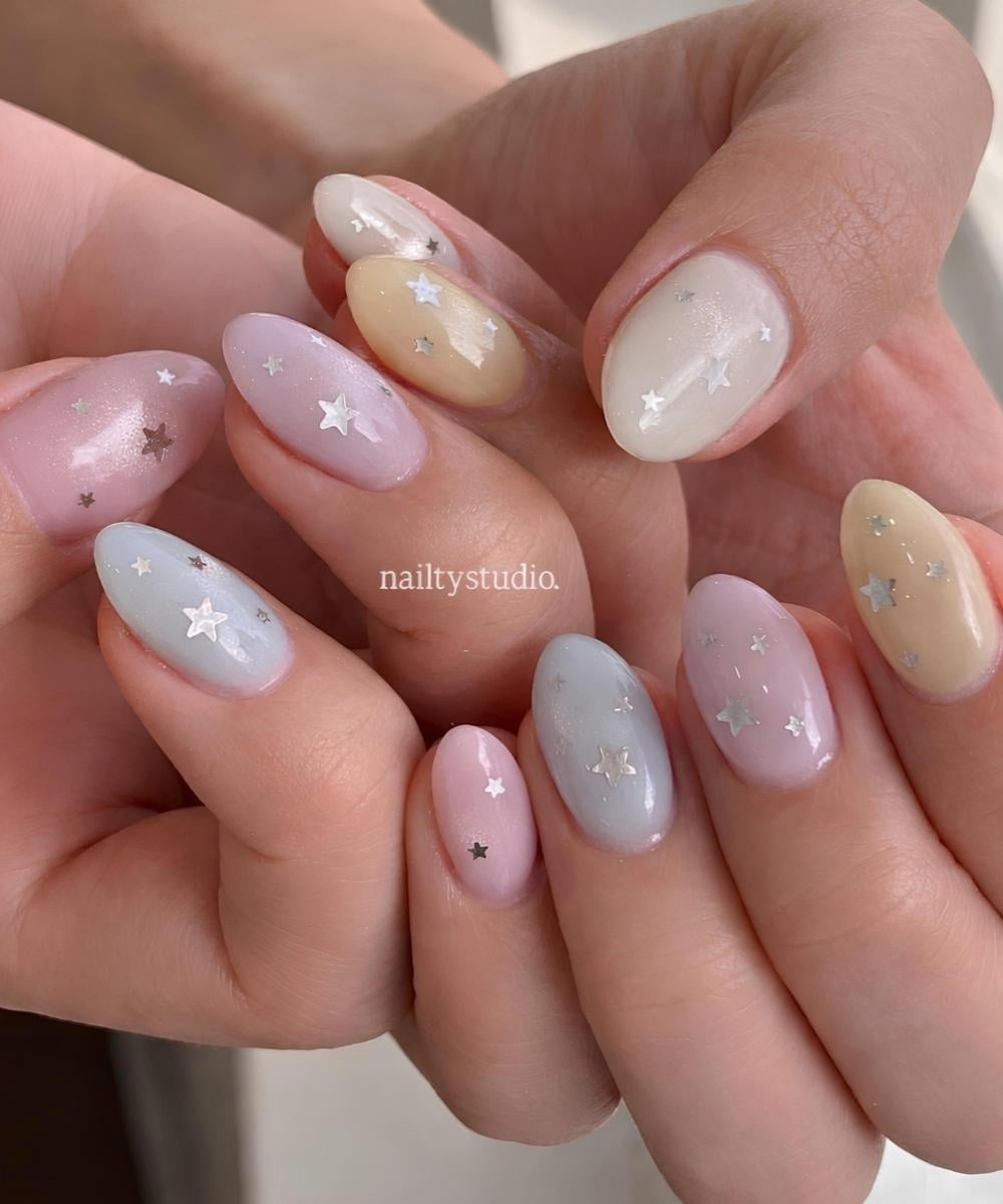 Colorful pastel nails with silver stars