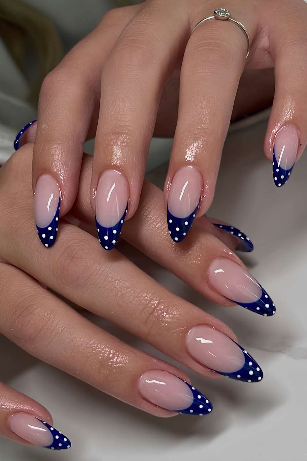 Navy blue polka dot French manicure