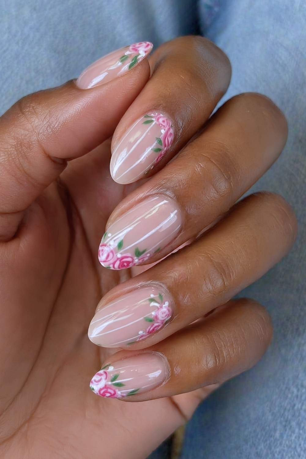 Neutral nails with stripes and rose art
