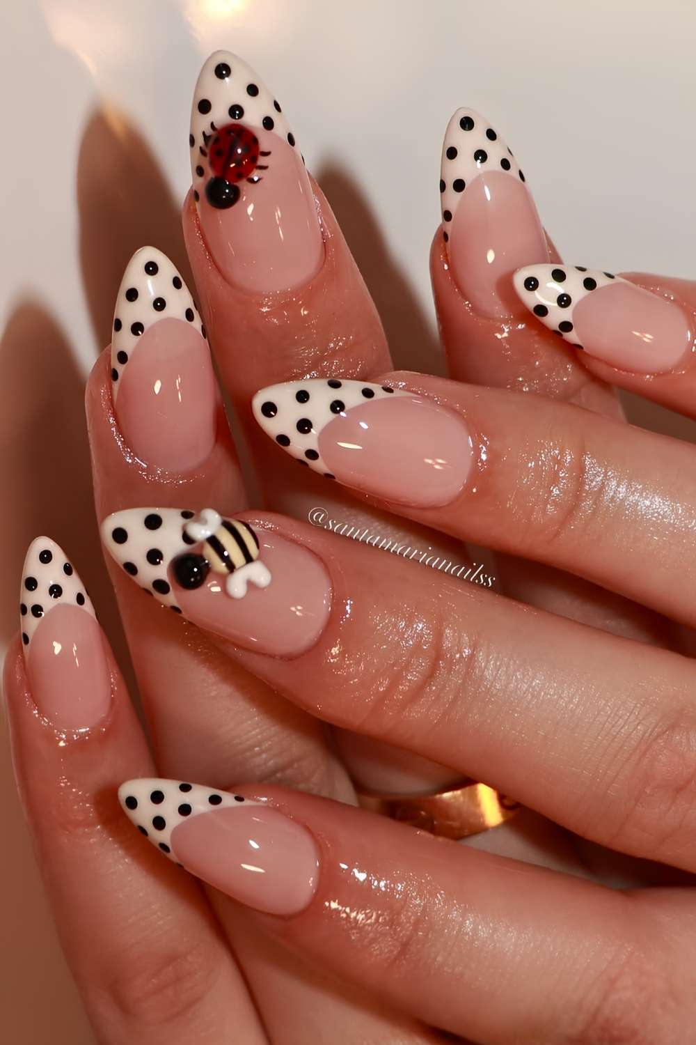 Off white polka dot French mani with bees and ladybugs