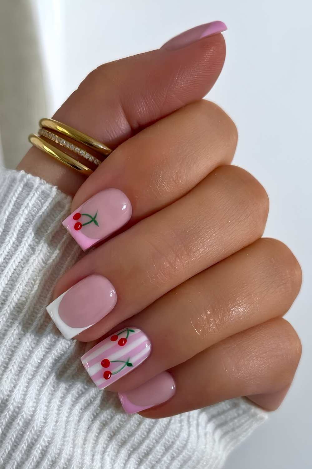Pastel pink and white mani with stripes and cherries