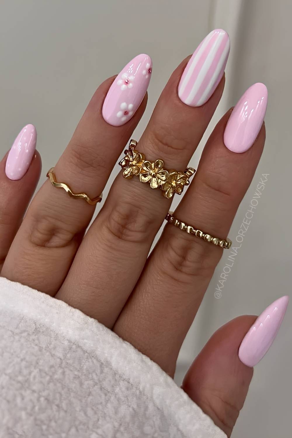 Pastel pink mani with flowers and stripes