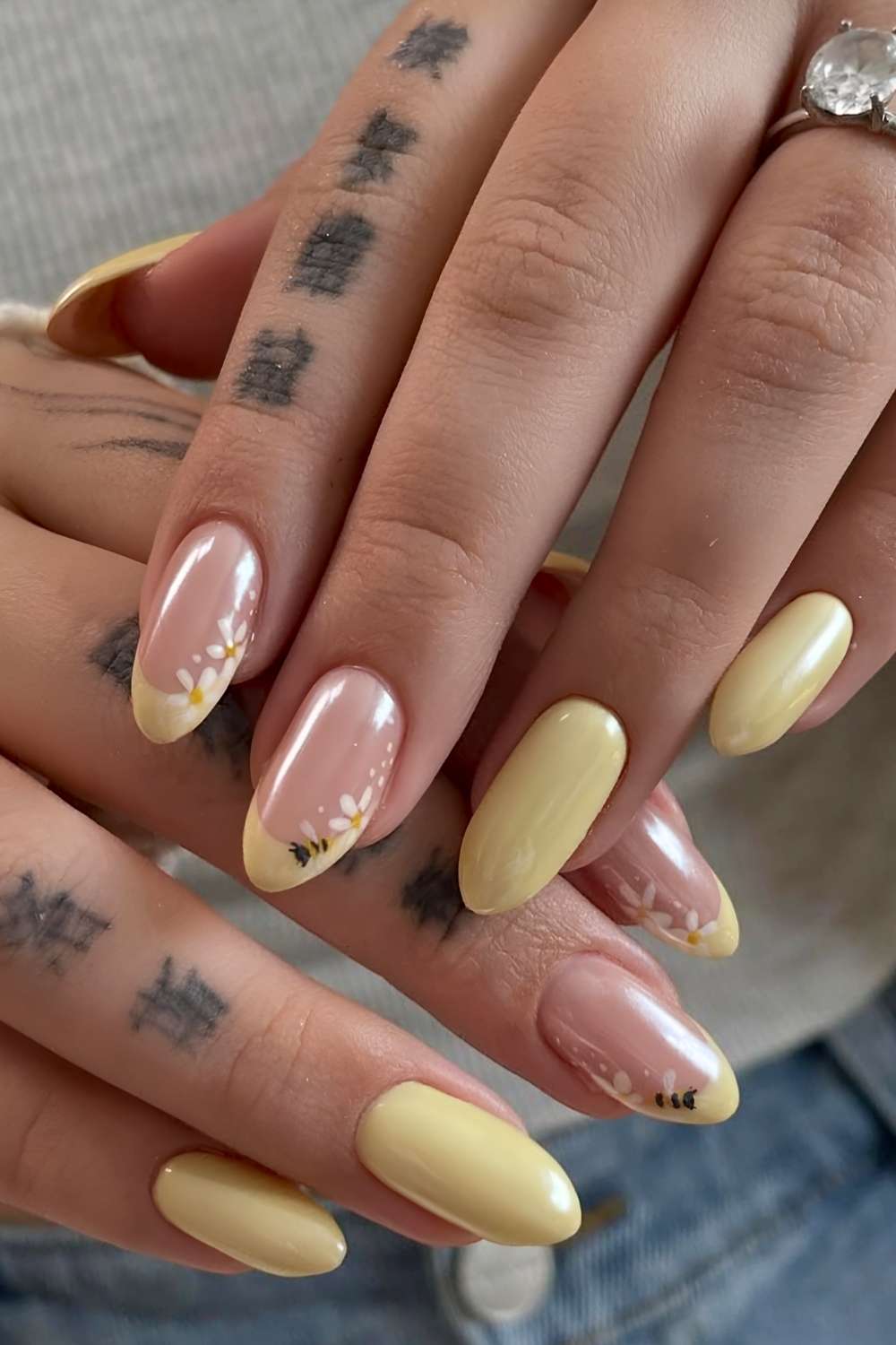 Pastel yellow chrome nails with bees and flowers