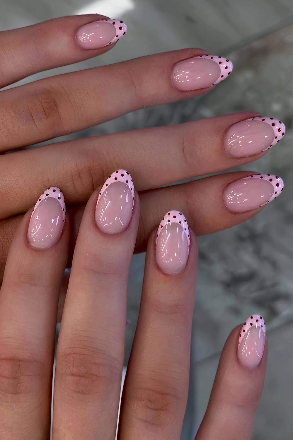 Pink and burgundy polka dot French nails