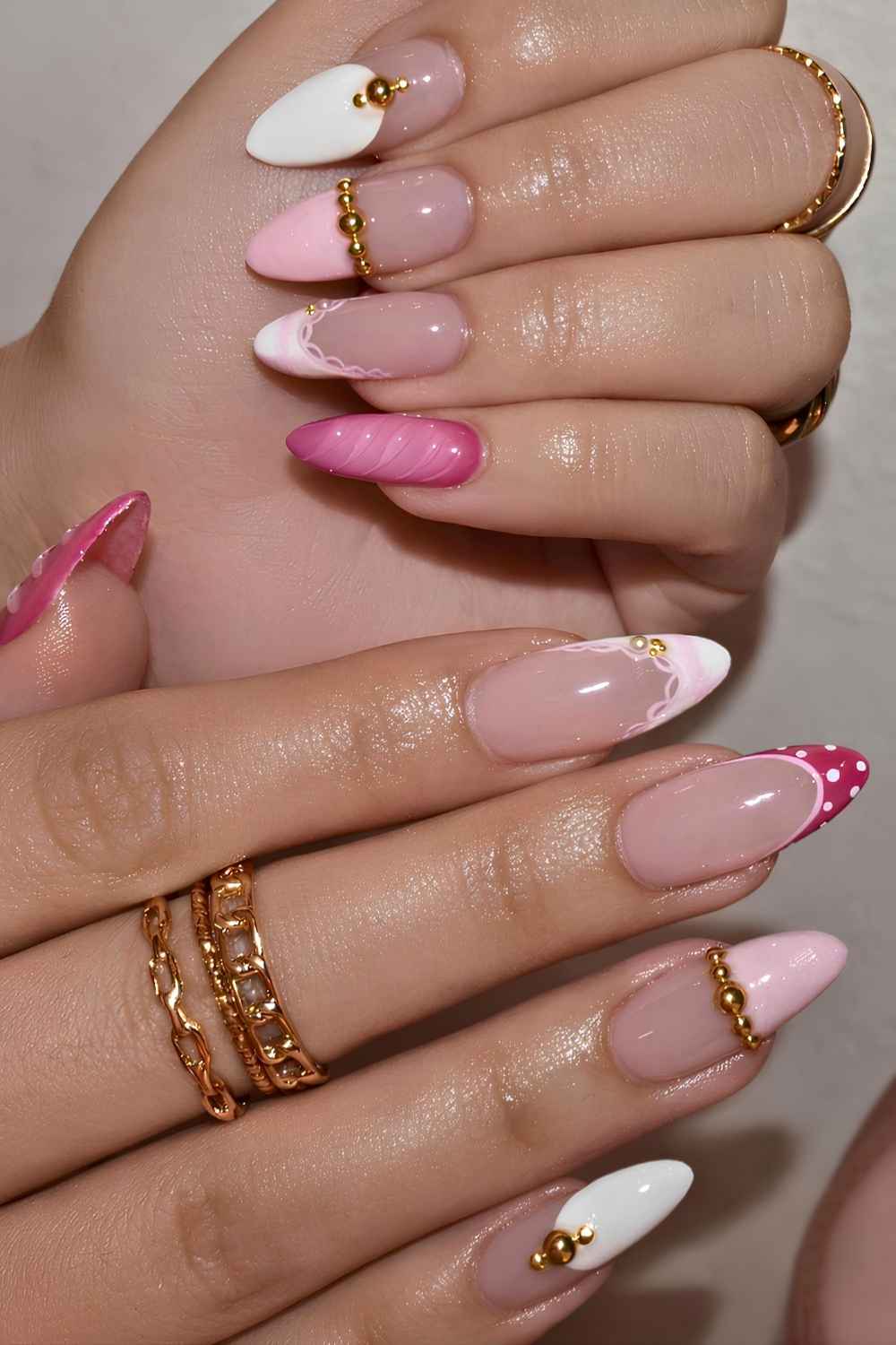 Pink and white French nails with gold details
