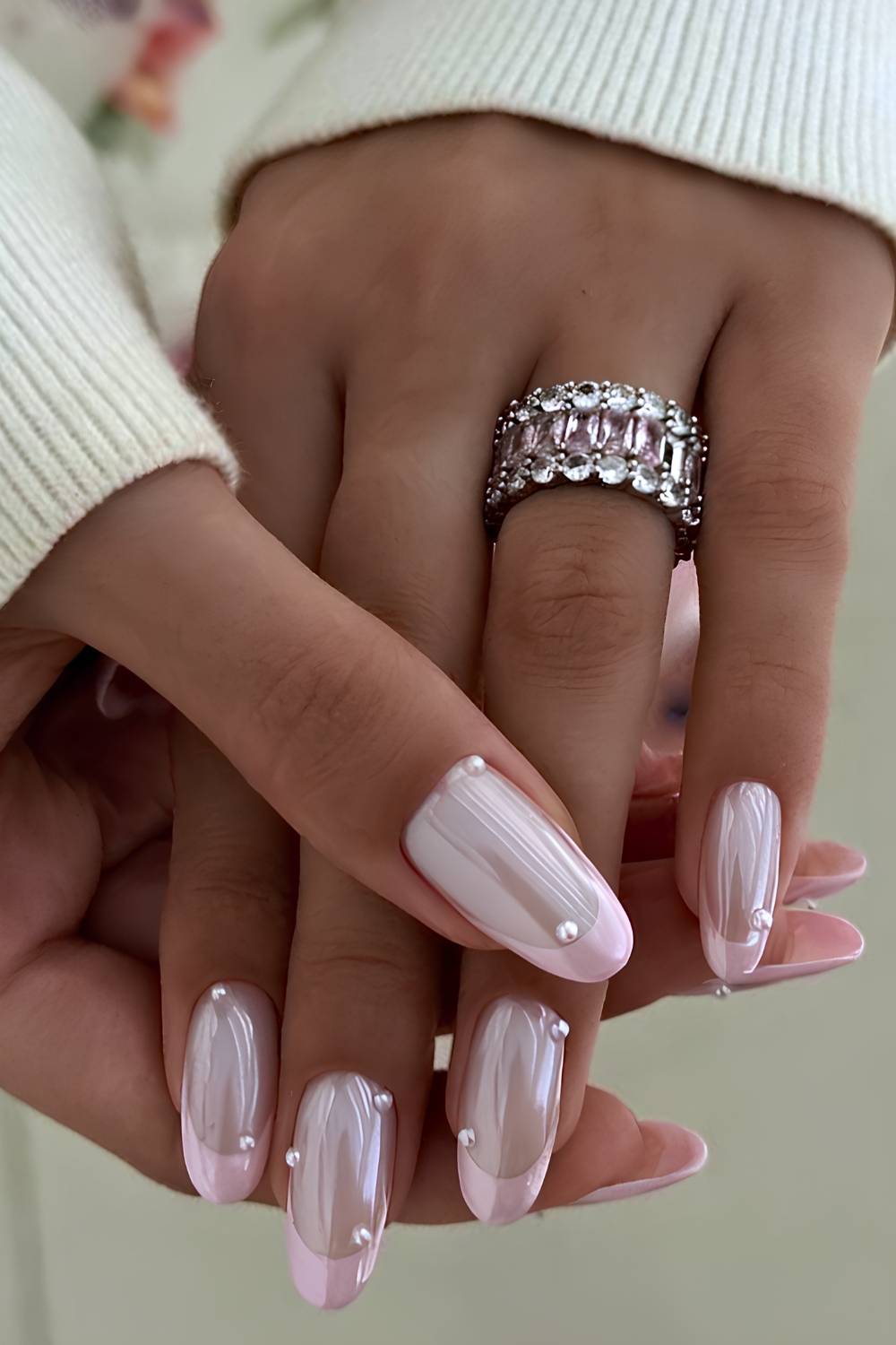 Pink chrome French nails with pearls
