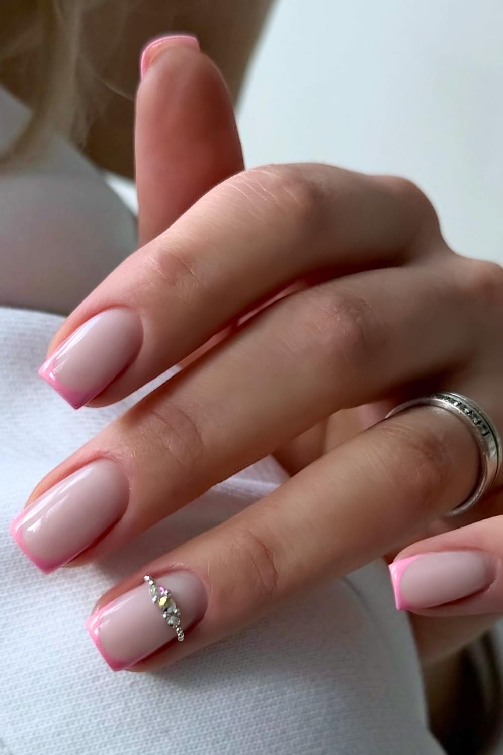 Pink micro French nails with gem accent