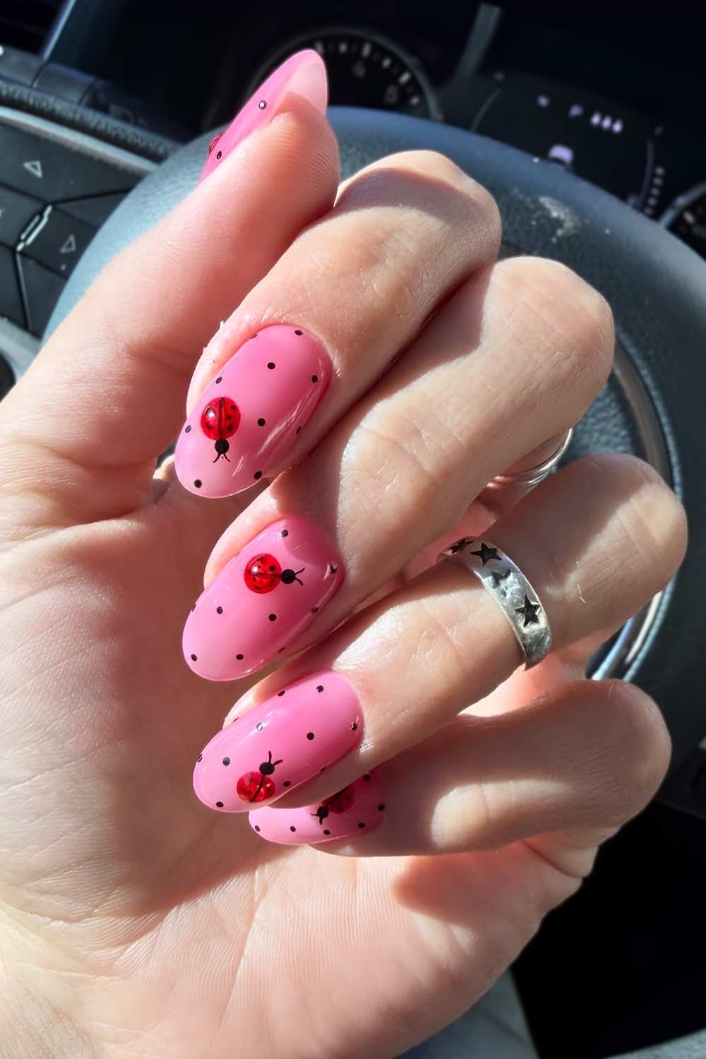 Pink nails with dot and ladybug art