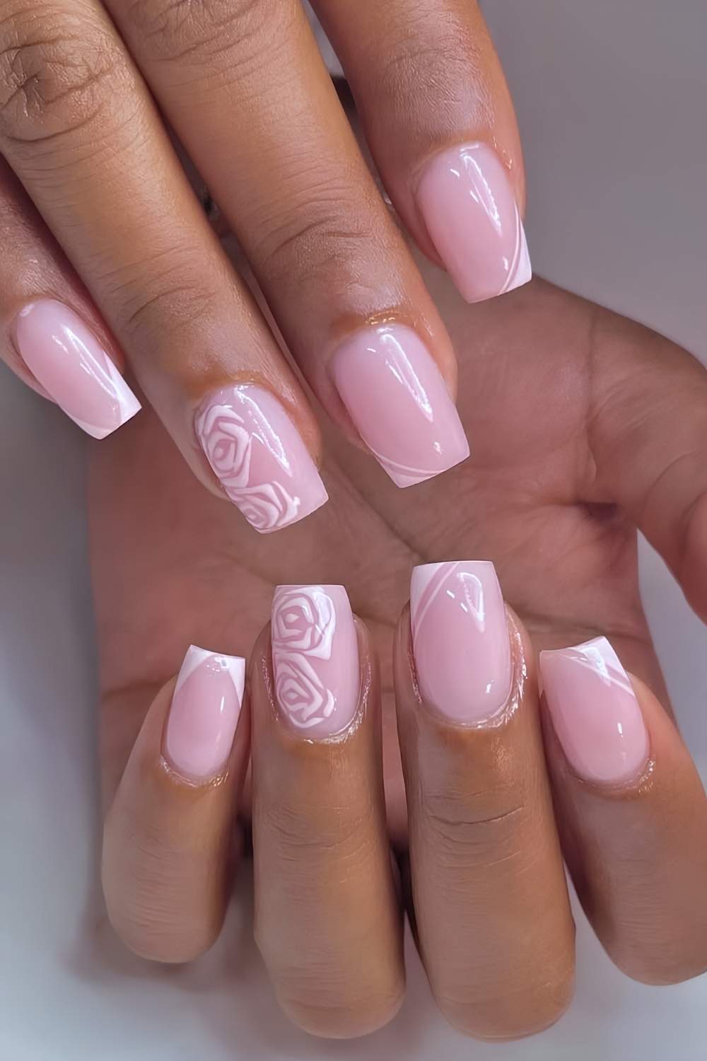 Pink nails with minimalist rose art