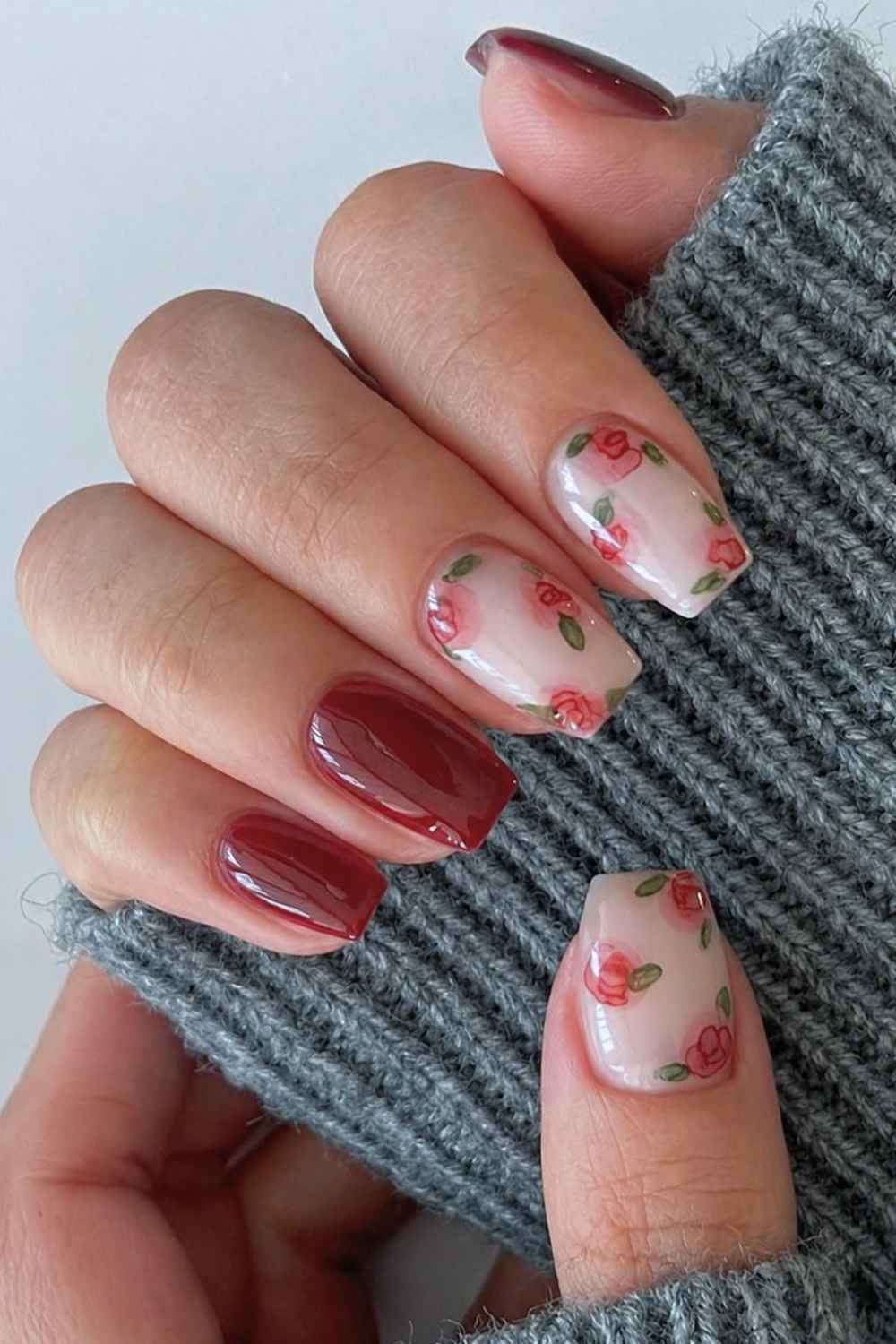 Red manicure with vintage style roses