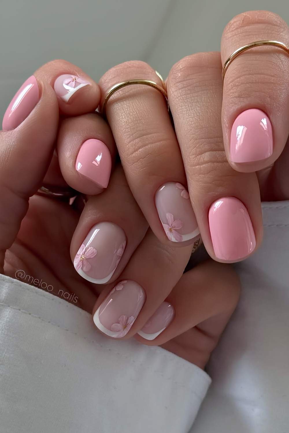 Short pink nails with floral art