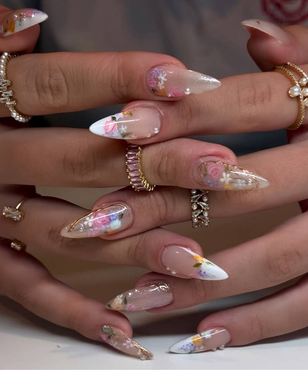 White French nails with vintage florals and gold accents
