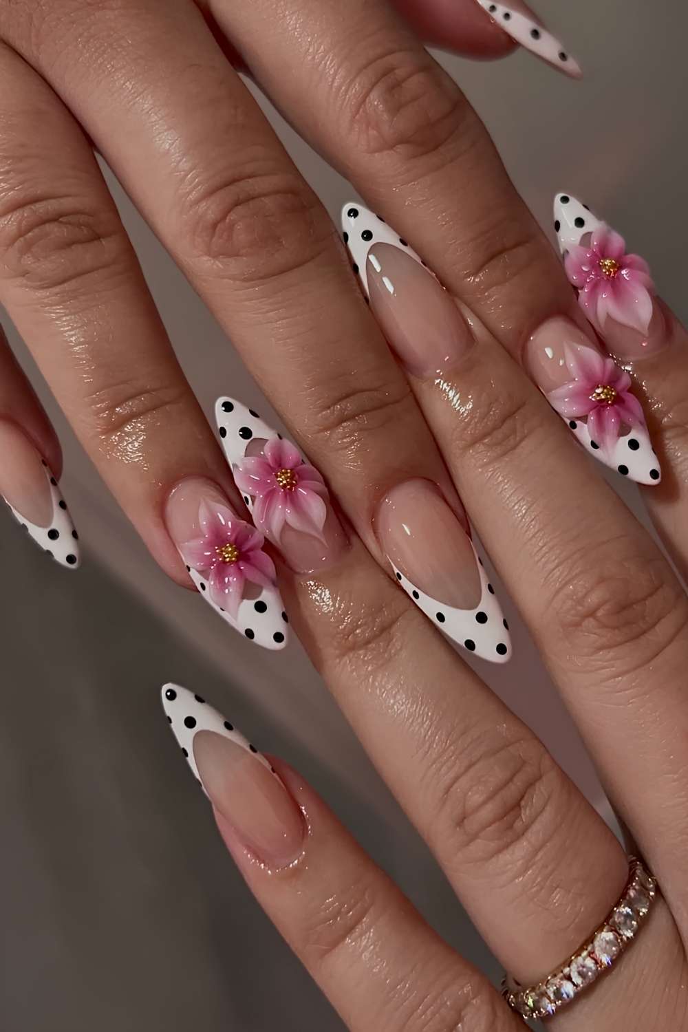 White polka dot French nails with 3d florals