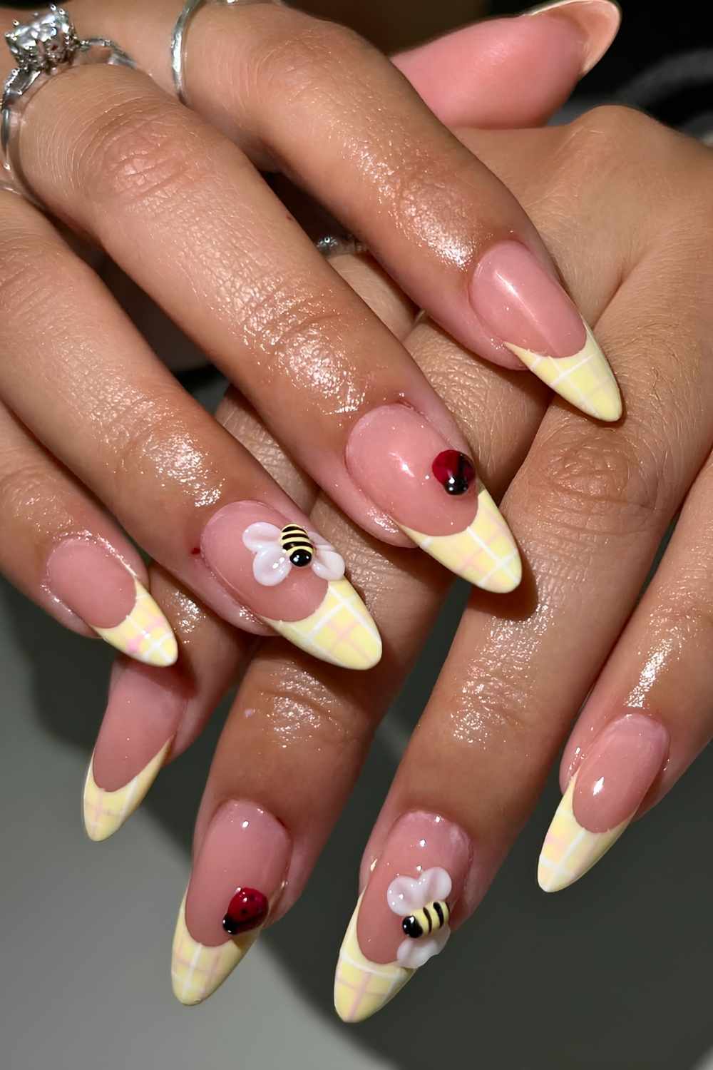 Yellow plaid French mani with bees and ladybugs