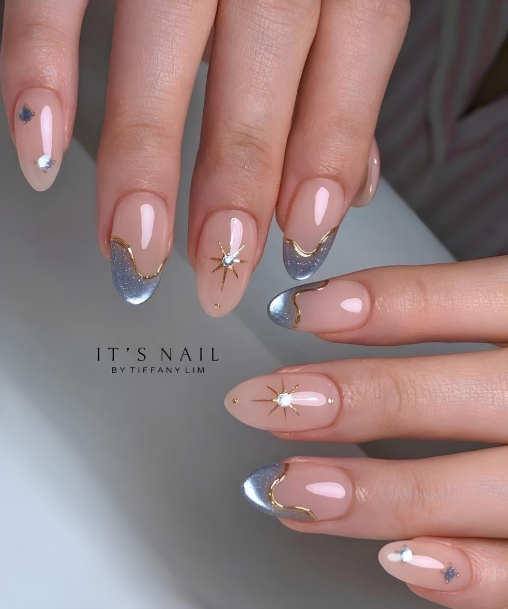 Abstract blue cat eye French mani with gold accents