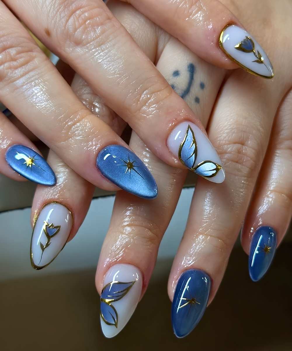 Blue cat eye nails with flowers and butterflies