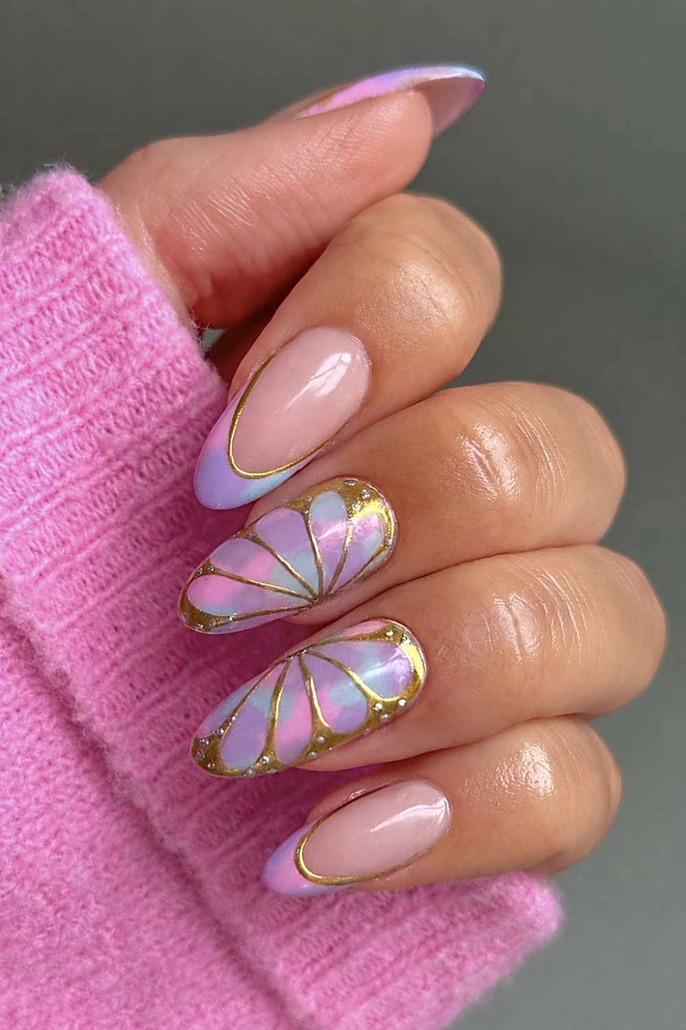 Colorful pastel nails with metallic butterfly art