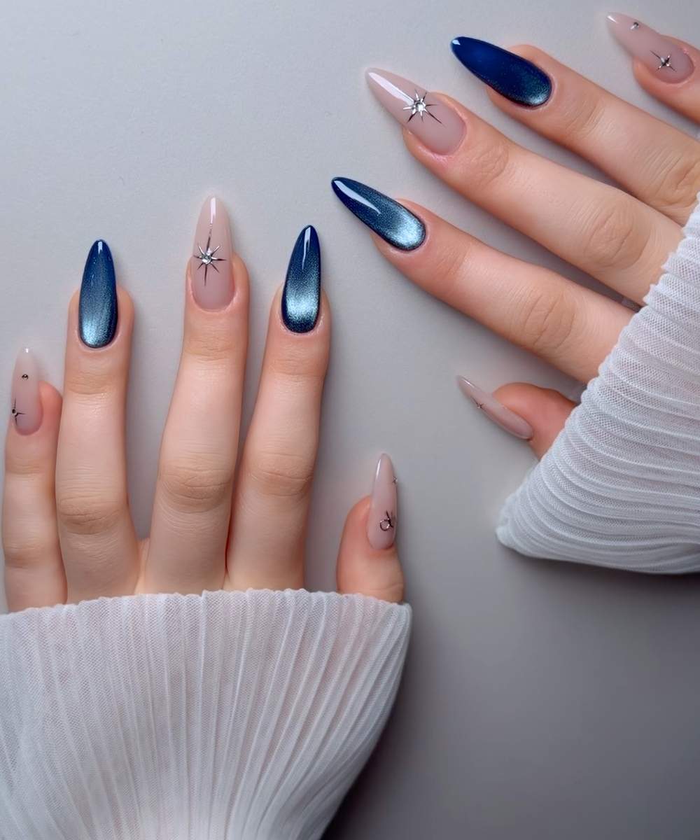 Deep blue cat eye nails with celestial art