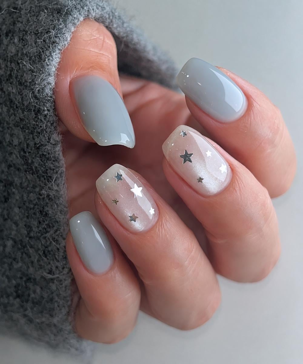 Misty blue nails with stars and accent cat eye