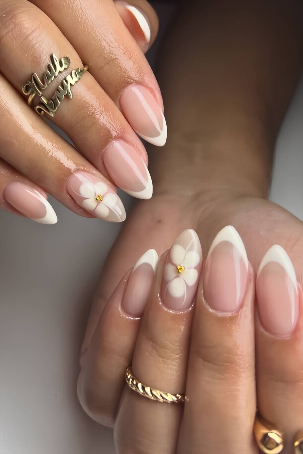 Neutral French mani with blooming gel flowers