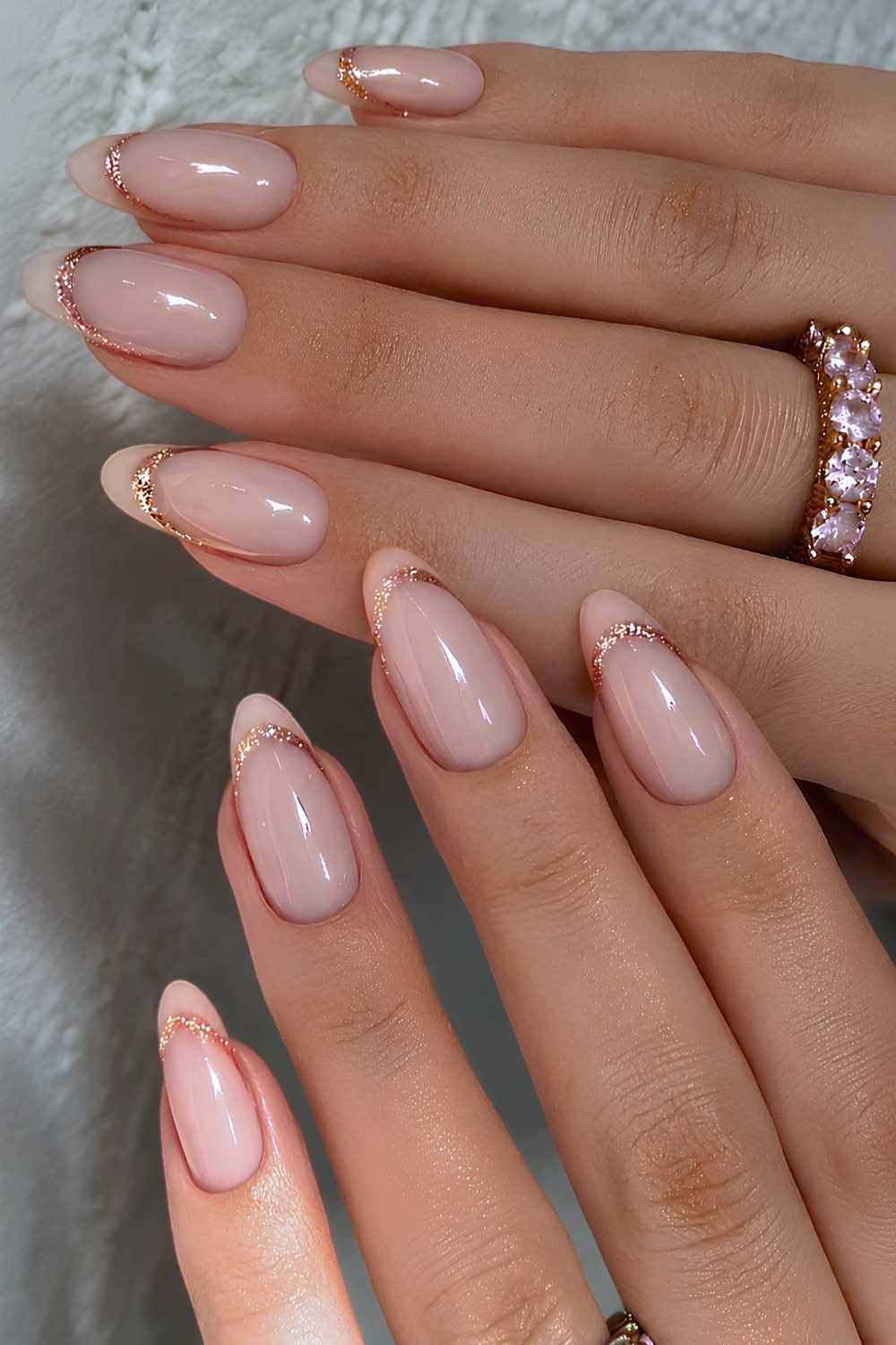 Neutral French manicure with glitter gold outline