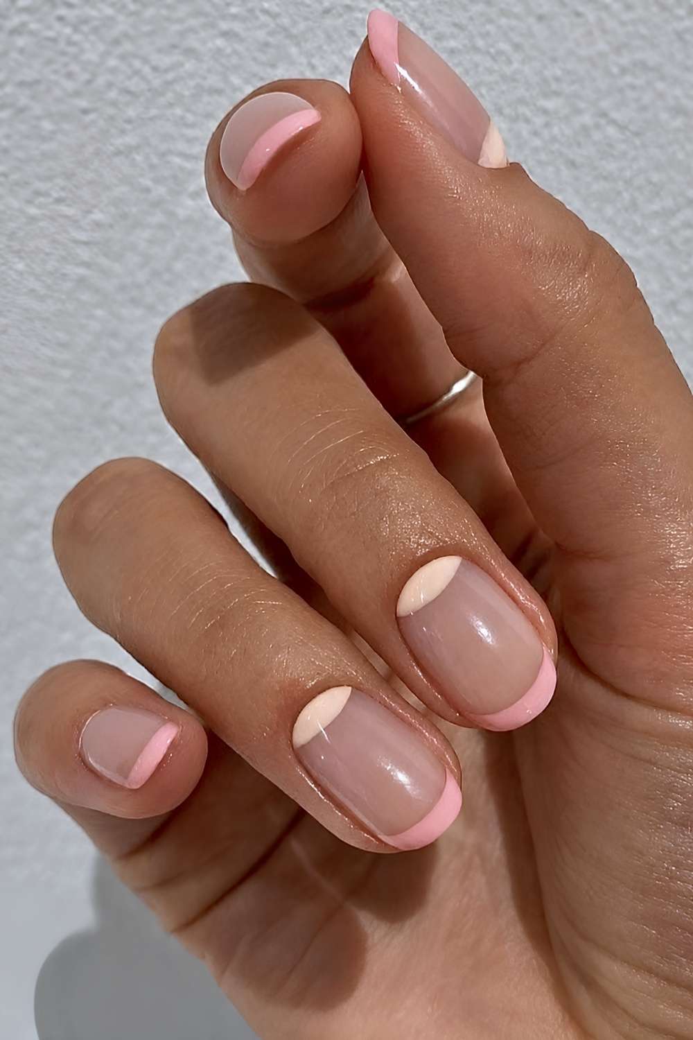 Pink French nails with half moon accents