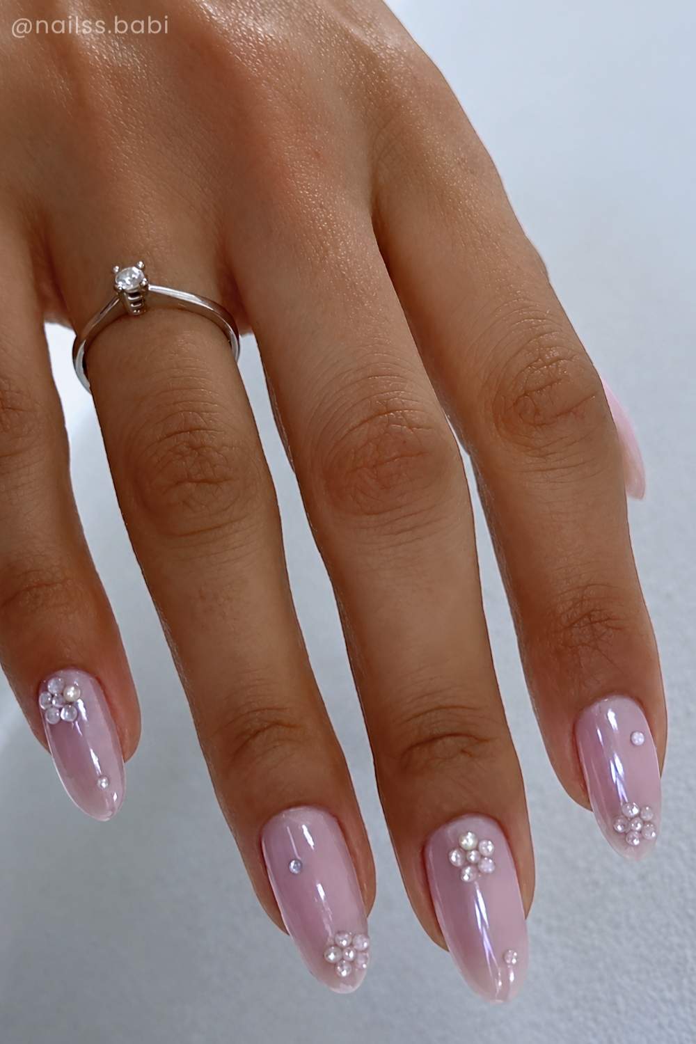 Pink chrome nails with gem flowers