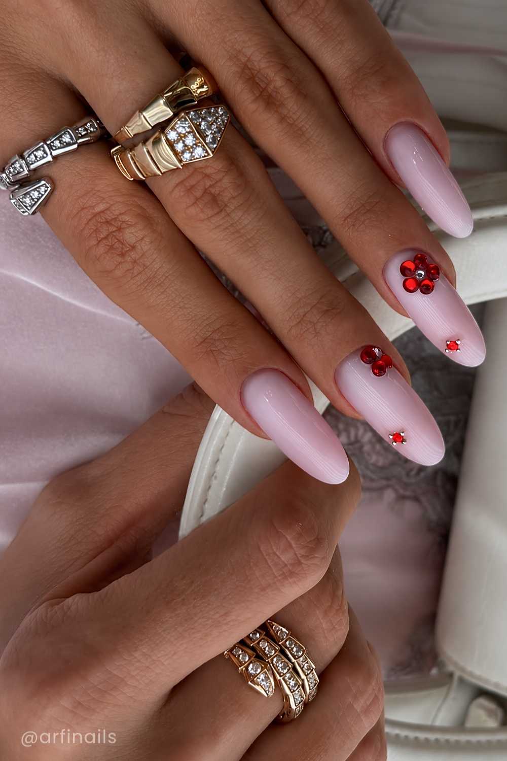 Pink nails with red gem flowers