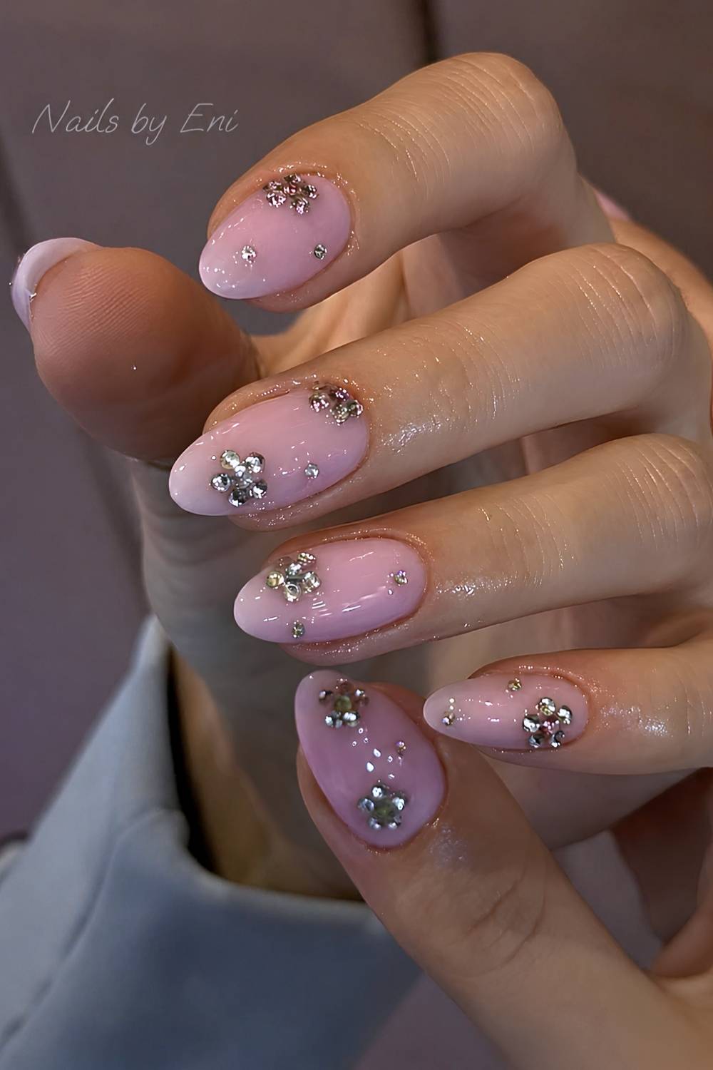 Pink nails with rhinestone flowers