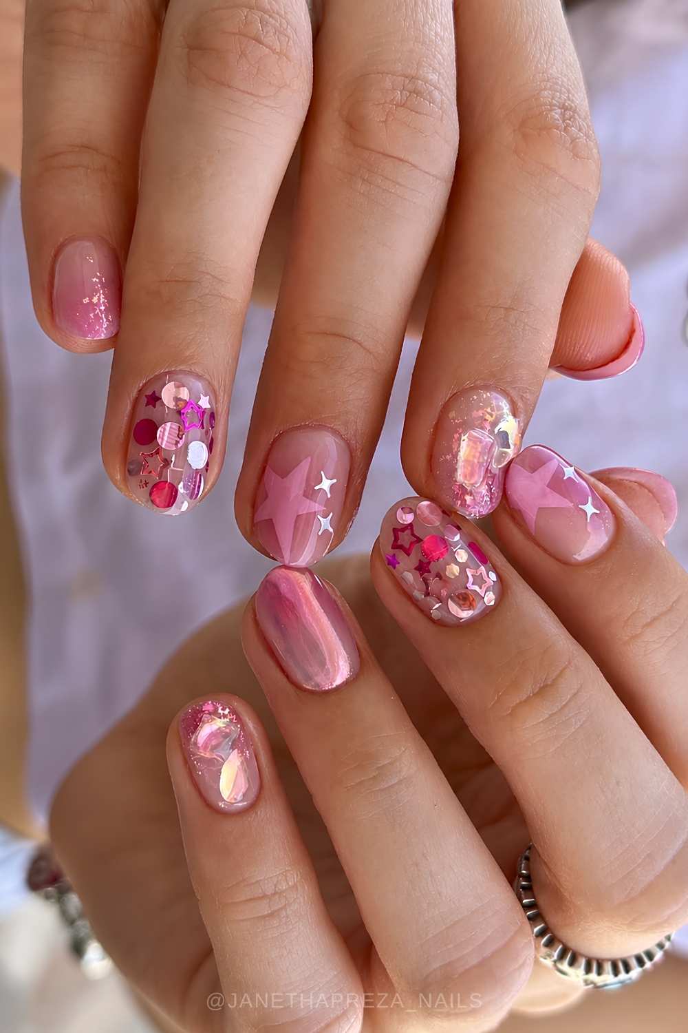 Pink nails with stars and confeti glitter