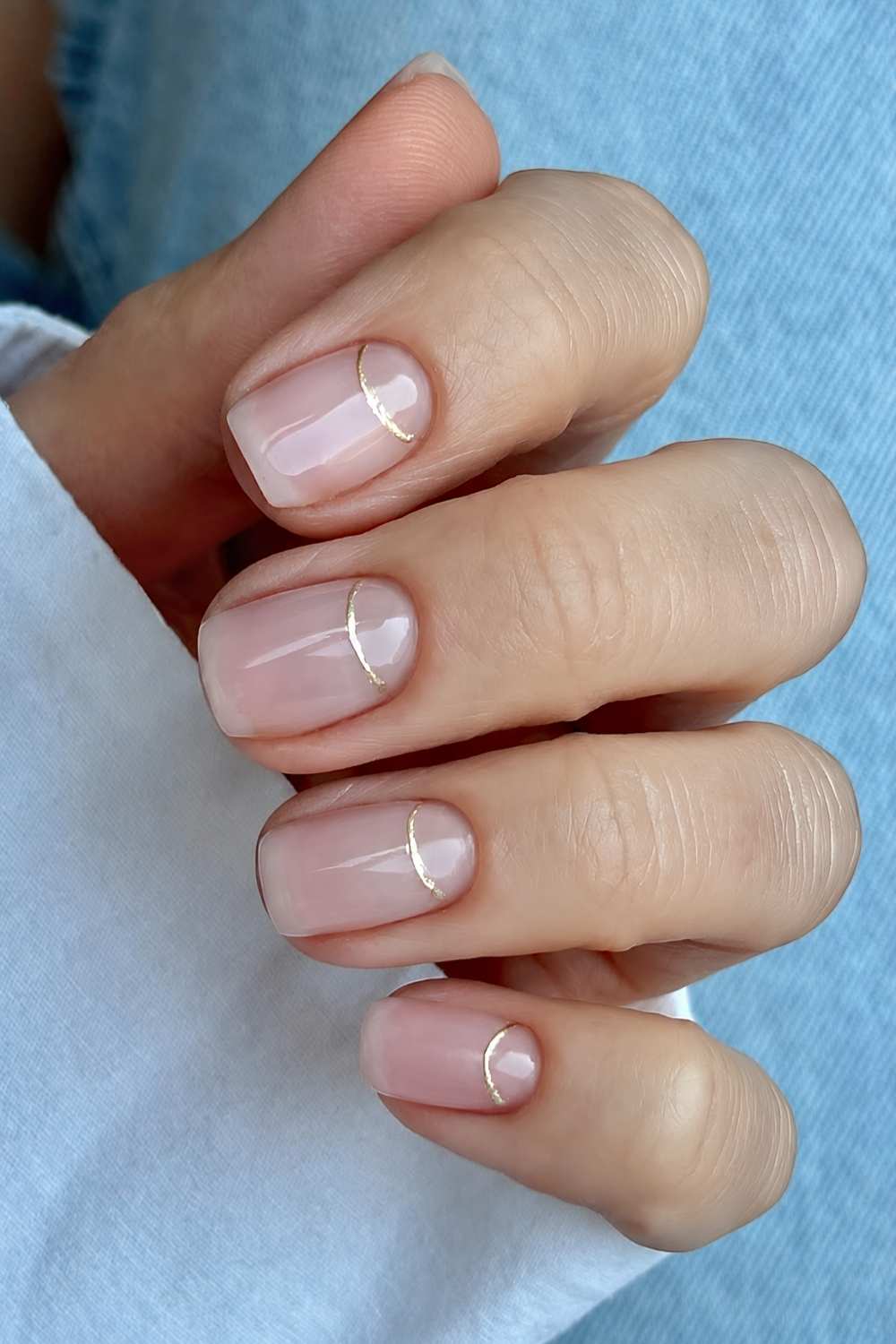 Sheer nails with glitter half moon outlines