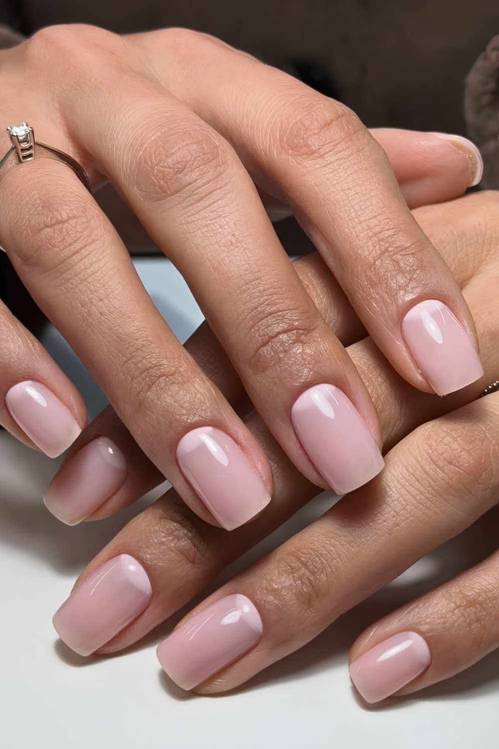 Sheer pink nails with half moon details